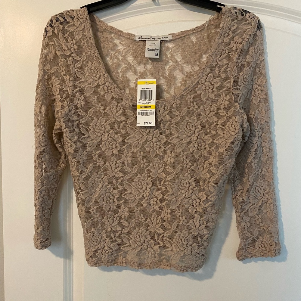 Tan cropped top. Stretchy.